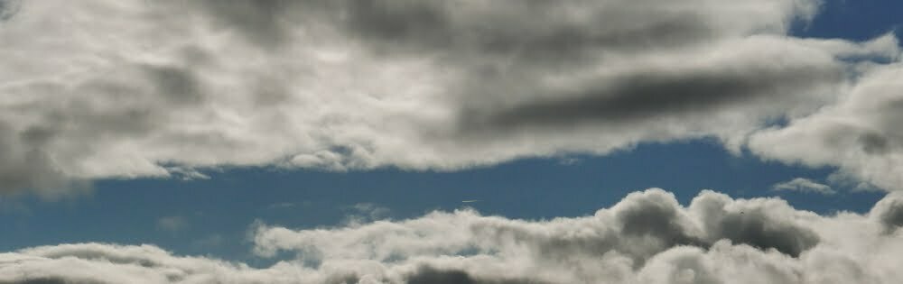 Sunlight and blue sky coming through clouds